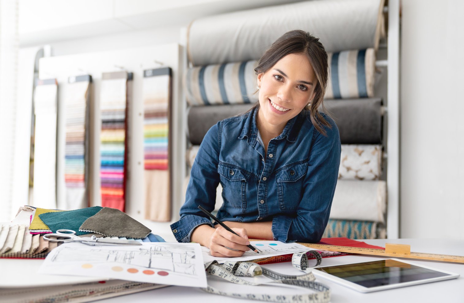 Interior designer choosing fabrics at a textile shop